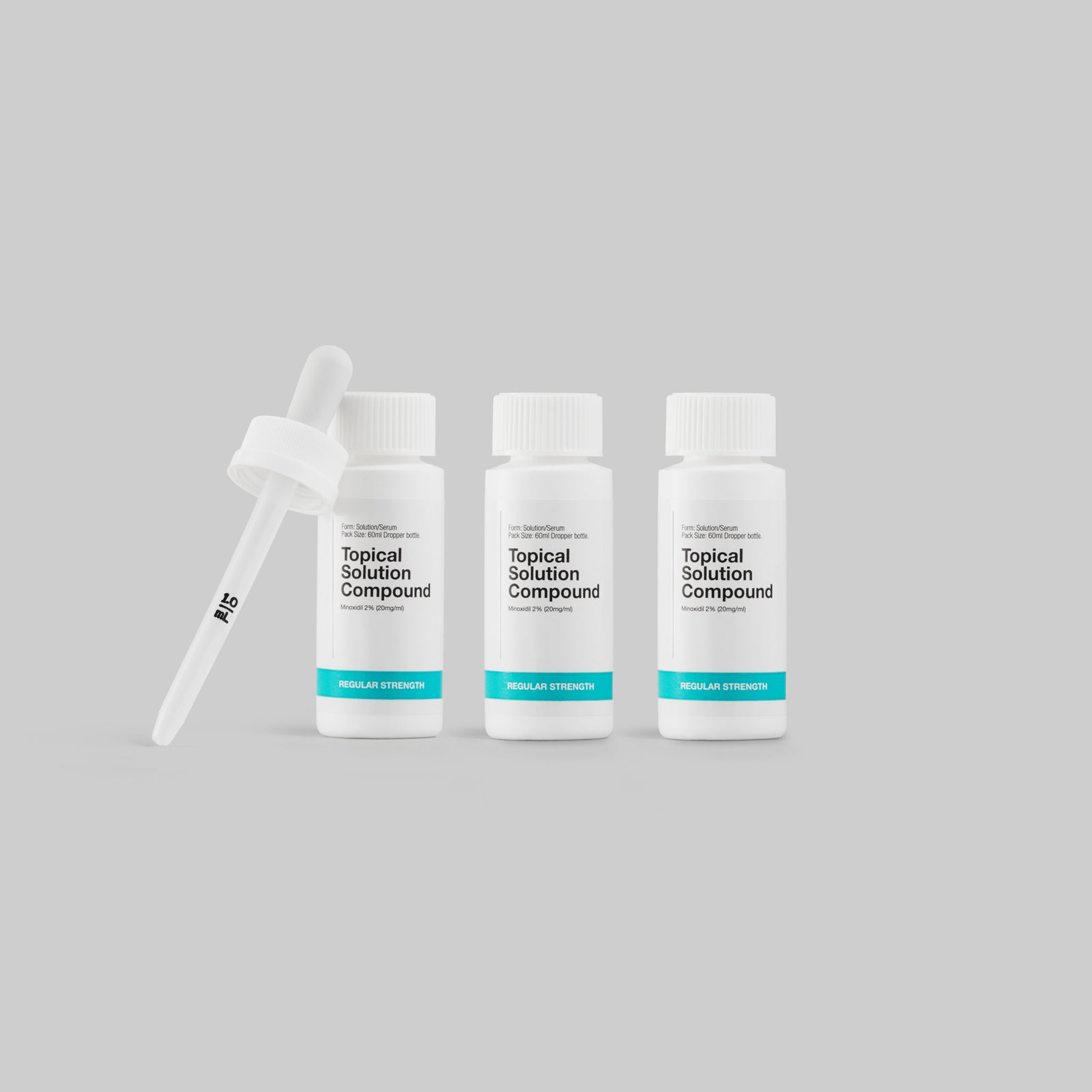 Three bottles of 'Topical Solution Compound' with a dropper on a gray background